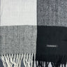 a close up of a plaid pashmina