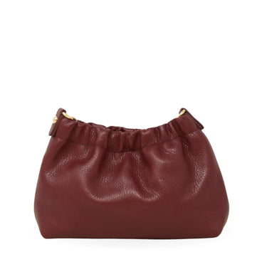 A burgundy leather clutch on a white background 