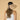 Woman wearing a beige visor with a bow on a beige background