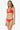 Woman wearing a red bikini on a white background