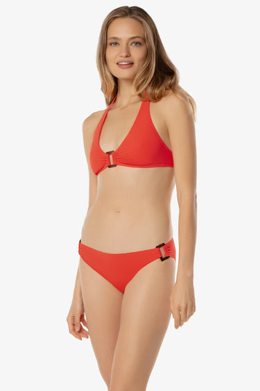 Woman wearing a red bikini on a white background