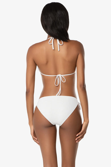 White bikini worn by a model on a white background
