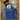 a medium navy bandana printed zipper pouch on a wooden table