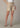 Beige denim shorts worn by a person on a neutral background