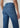 Mid-Rise ankle length Blue jeans worn by a person on a plain background