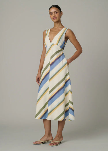 A woman wearing a v-neck multi-colored striped midi dress