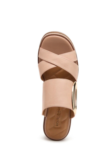 Light pink sandal with a brown sole on a white background