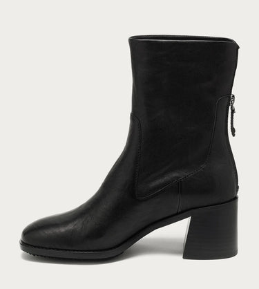 The image shows the side of a black leather heeled ankle boot on a white background