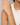 A woman wearing a dainty chain adjustable bracelet