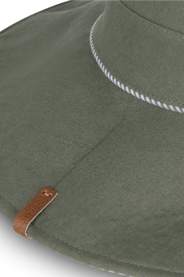 a close up of the floppy green hat