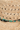 Close-up of a woven straw hat with decorative beads.