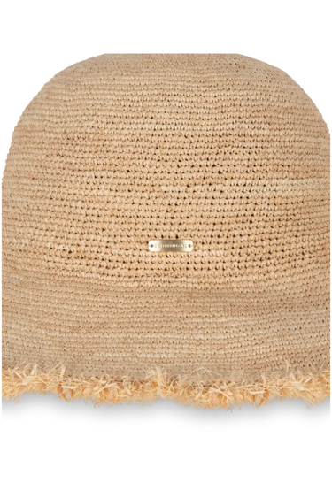 Beige straw hat with a frayed edge on a white background