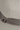 A grey fedora on a neutral background