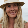 Woman wearing a straw hat with a blurred background