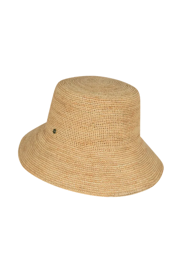 a straw bucket hat on a neutral background