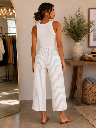 a woman wearing cropped wide leg striped cropped pants 