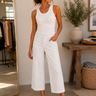 a woman wearing cropped wide leg striped cropped pants 