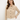 Woman wearing a beige denim jacket on a white background