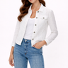 Woman wearing a white denim jacket and blue jeans on a white background