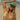 Woman wearing a green cap with text on a beach