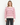 A woman wearing a cashmere beige pink-striped sweater on a white background.