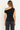 Delilah black off-the-shoulder top, back view showing gathered neckline and close-to-body silhouette