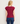 A woman shown from the back wearing a ribbed short-sleeve top in deep burgundy and blue jeans, standing against a plain light gray background.