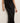 a woman wearing a black tee and a black bias midi skirt on a white background.