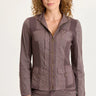 Woman wearing a brown jacket and pants on a white background
