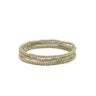 Set of three beaded platinum bracelets on a white background