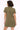 Woman wearing an olive green dress on a white background