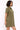 Woman wearing a green dress against a white background
