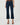 A model wearing dark blue cropped flare jeans with a brown top and brown strappy high-heeled sandals, shown from the waist down on a light gray studio background.