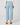 Light blue cropped straight jeans worn by a person on a white background