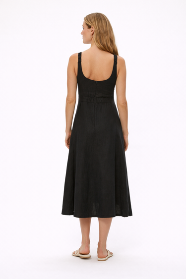 Woman wearing a black sleeveless dress on a white background
