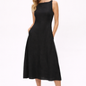Woman wearing a black sleeveless dress on a white background