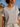 Woman wearing a striped shirt on a beach