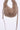 A taupe faux fur crescent shoulder bag with a matching fabric strap and silver-tone hardware, shown against a plain white background.