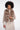 Woman wearing a brown faux fur vest on a white background