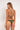 Woman wearing a green bikini with a white background