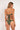 Woman wearing a green bikini with a plain background