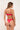 Woman wearing a red bikini against a plain background