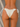 Beige bikini bottom against a neutral background