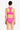 Woman wearing a pink bikini set on a white background