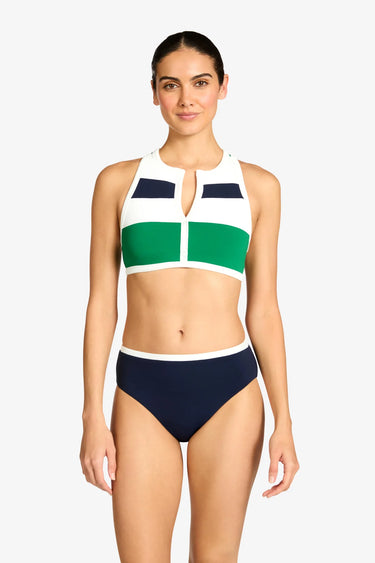 Woman wearing a colorful bikini set on a white background