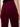 Close-up back view of a person wearing burgundy corduroy pants, showing the back pocket and a small black brand tag on the upper right side.