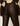 Close-up of a person wearing dark brown faux-leather pants and a brown and cream argyle sweater, shown from the back against a light neutral background.