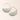 Gold hoop earrings with semi-circular jade-like stones on a light pink background
