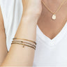 Set of three stacking bracelets on a woman's wrist