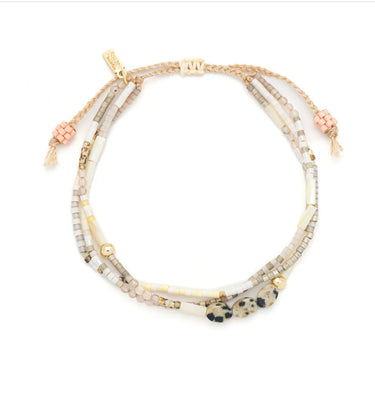 a semi-precious stone bracelet on a white background